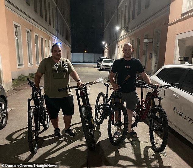 Mr Groves (right) with a friend in Warsaw, Poland. Here, they are pictured on August 18, having just got the bikes back after they were stolen on June 25